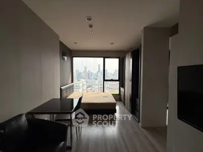 Modern studio apartment with city view and sleek furnishings