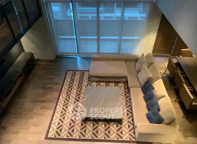 Spacious modern living room with stylish sectional sofa and elegant coffee table, perfect for relaxation and entertainment.