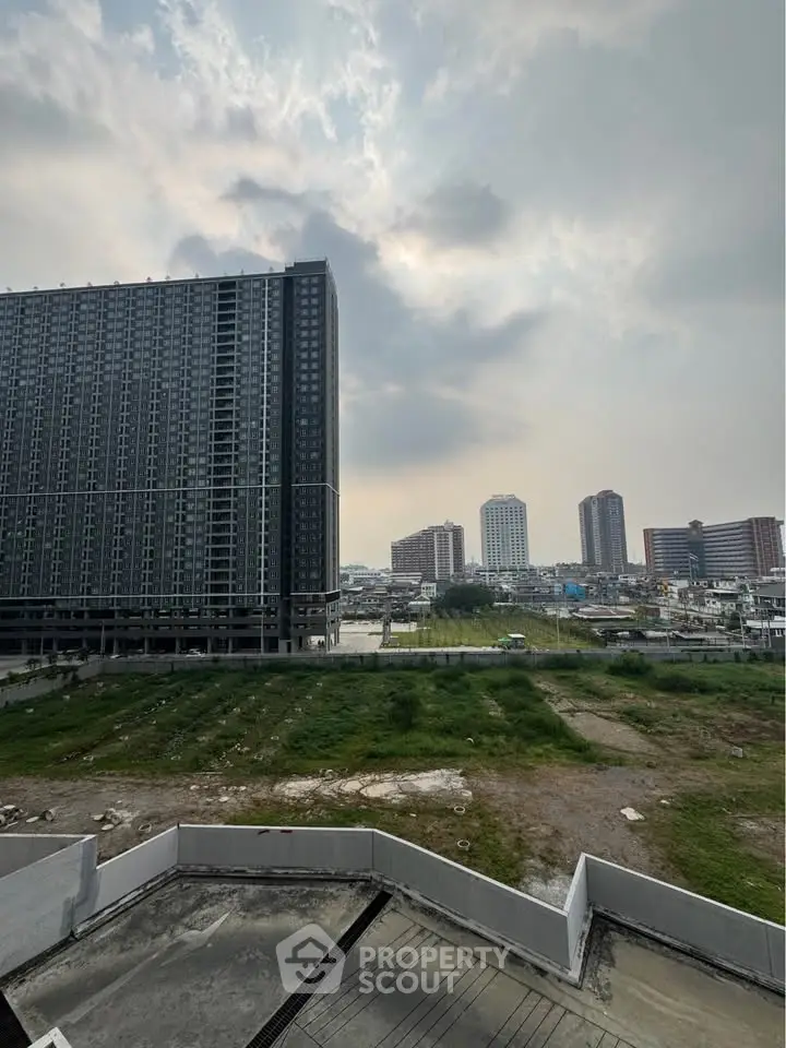 Urban skyline view with modern high-rise buildings and open green space