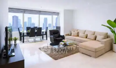 Spacious modern living room with city view, elegant furniture, and abundant natural light.