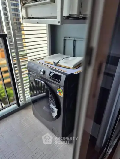 Modern balcony with washing machine and city view