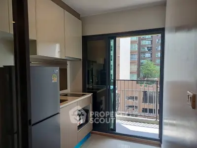 Modern kitchen with balcony view in urban apartment