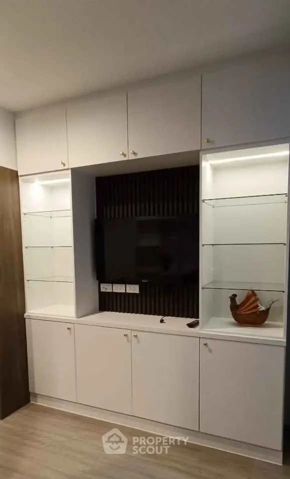 Modern living room with built-in cabinets and sleek TV setup