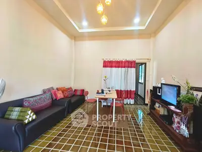 Spacious living room with stylish decor and ample natural light, perfect for relaxation and entertainment.