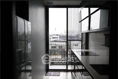 Modern kitchen with sleek design and city view from large window