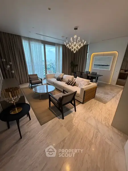 Luxurious living room with elegant chandelier and city view, perfect for modern urban living.