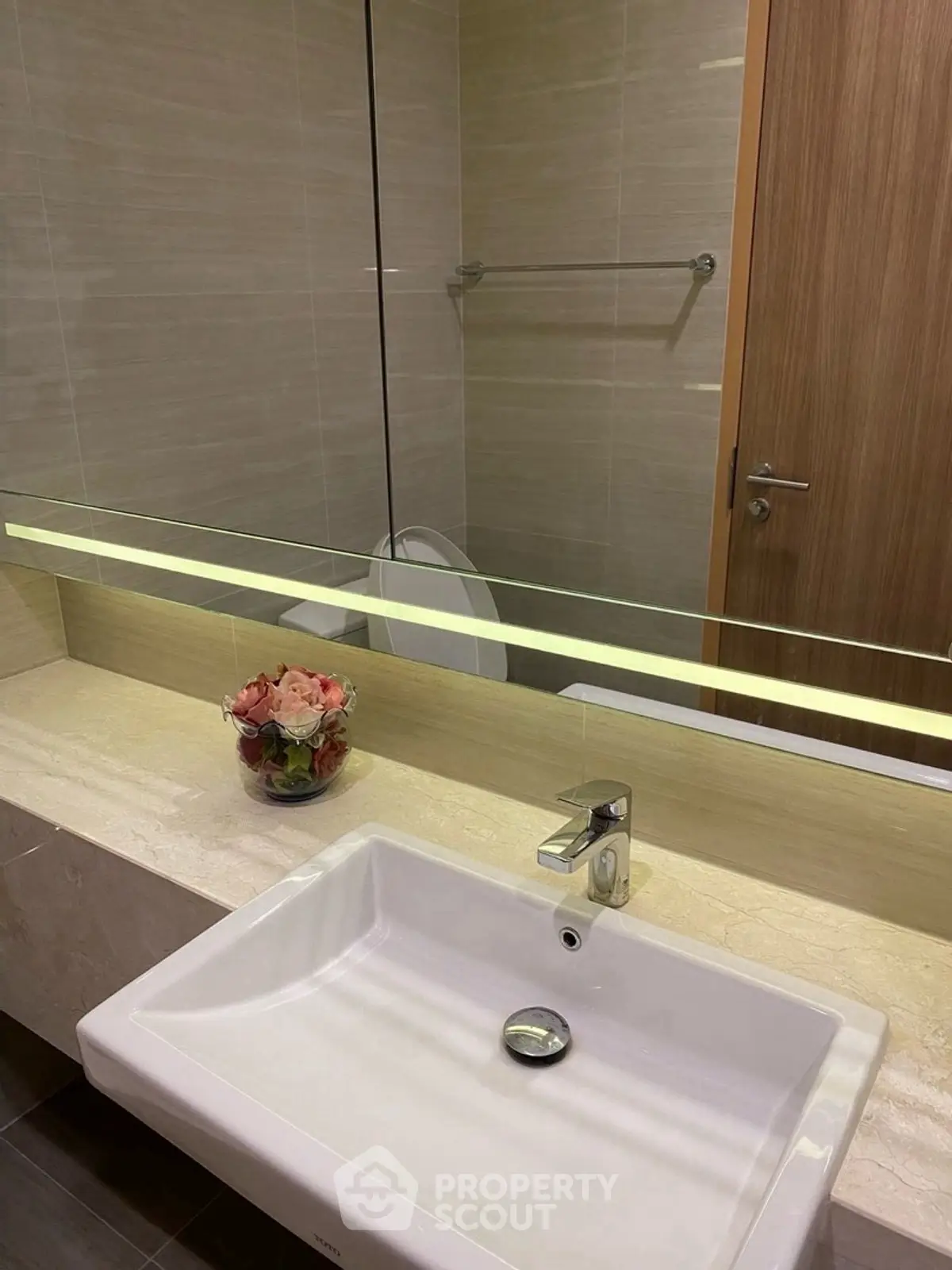 Modern bathroom with sleek sink and elegant mirror design