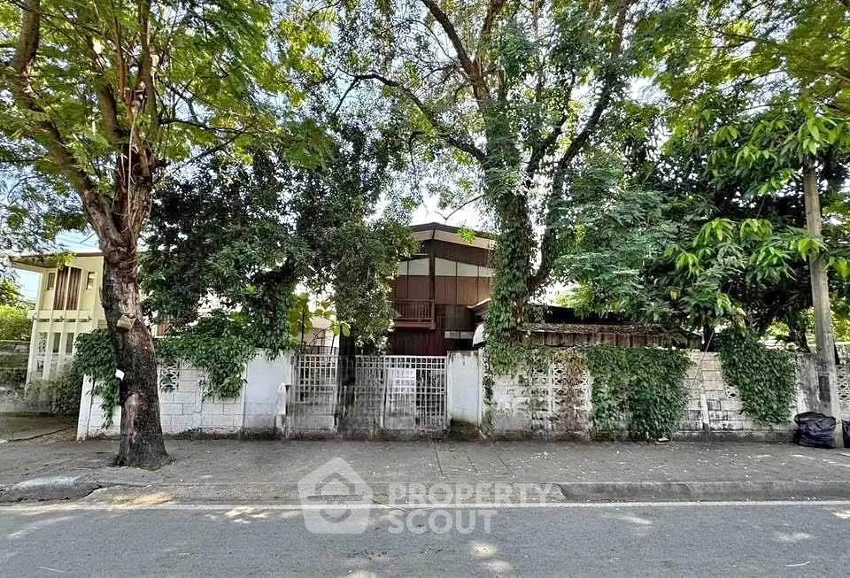 Charming residential property with lush greenery and spacious front yard