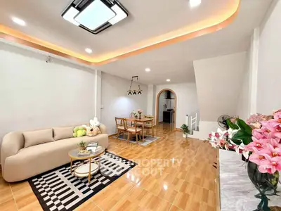 Stylish modern living room with cozy seating and elegant dining area