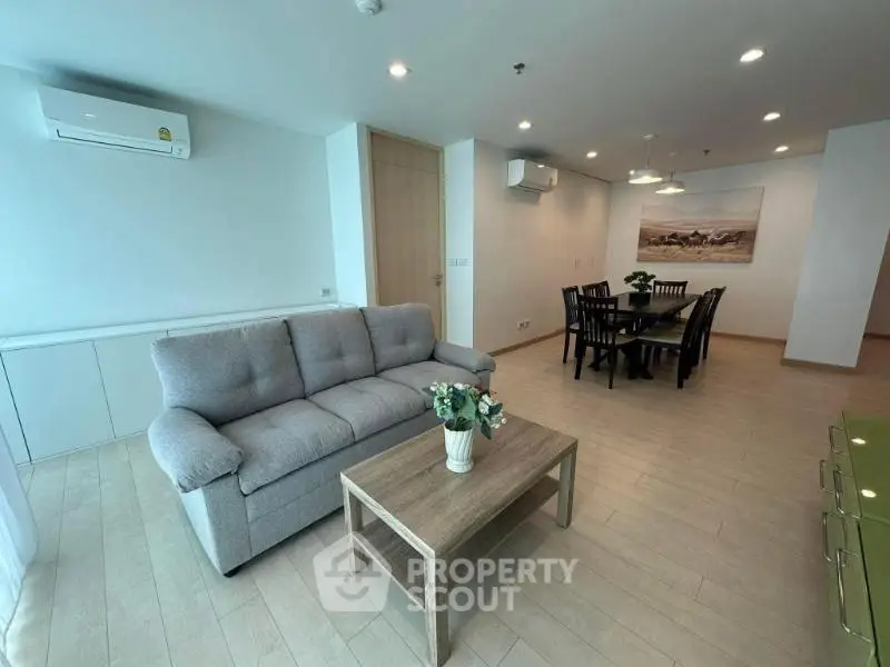 Spacious modern living room with elegant dining area and stylish decor