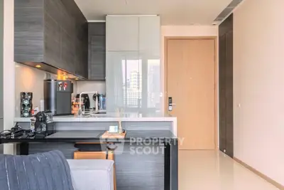 Modern kitchen with sleek cabinetry and open layout in a stylish apartment.