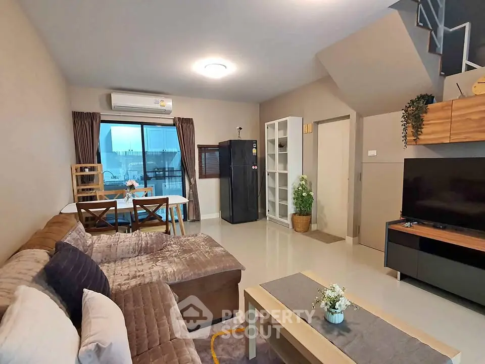 Modern living room with cozy sofa and stylish decor in a contemporary home.