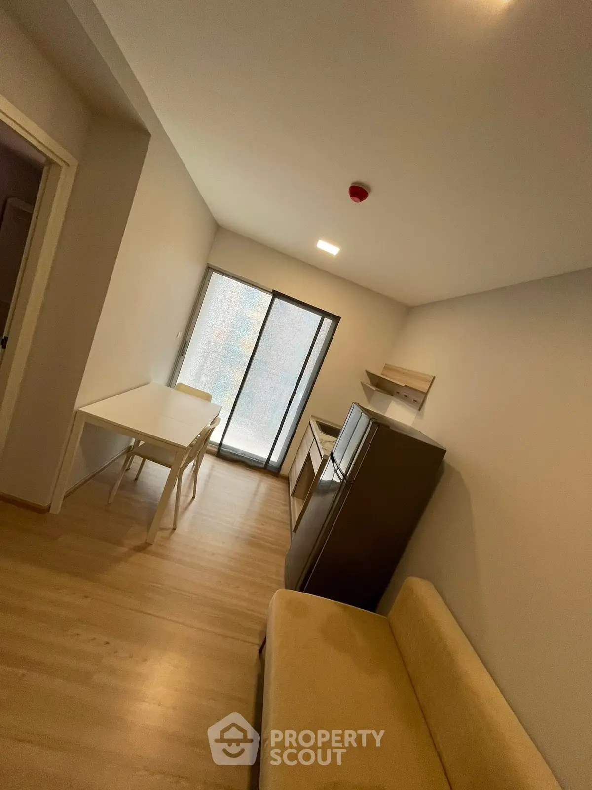 Modern compact living room with minimalist furniture and natural light