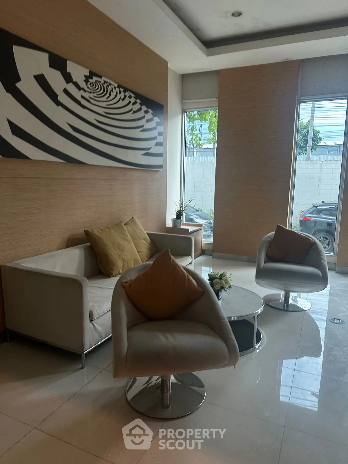 Stylish modern living room with chic furniture and abstract wall art