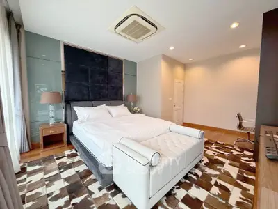 Luxurious bedroom with elegant decor and plush bedding in modern apartment