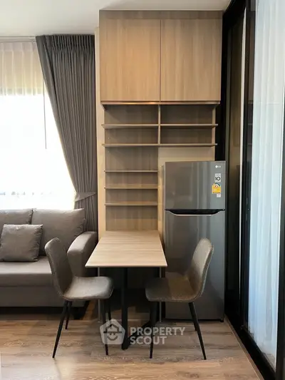 Modern apartment interior with cozy dining area and sleek kitchen design