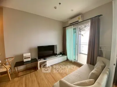 Modern living room with balcony access and sleek wooden flooring
