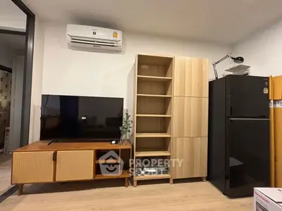 Modern living room with sleek furniture and air conditioning unit, perfect for urban living.