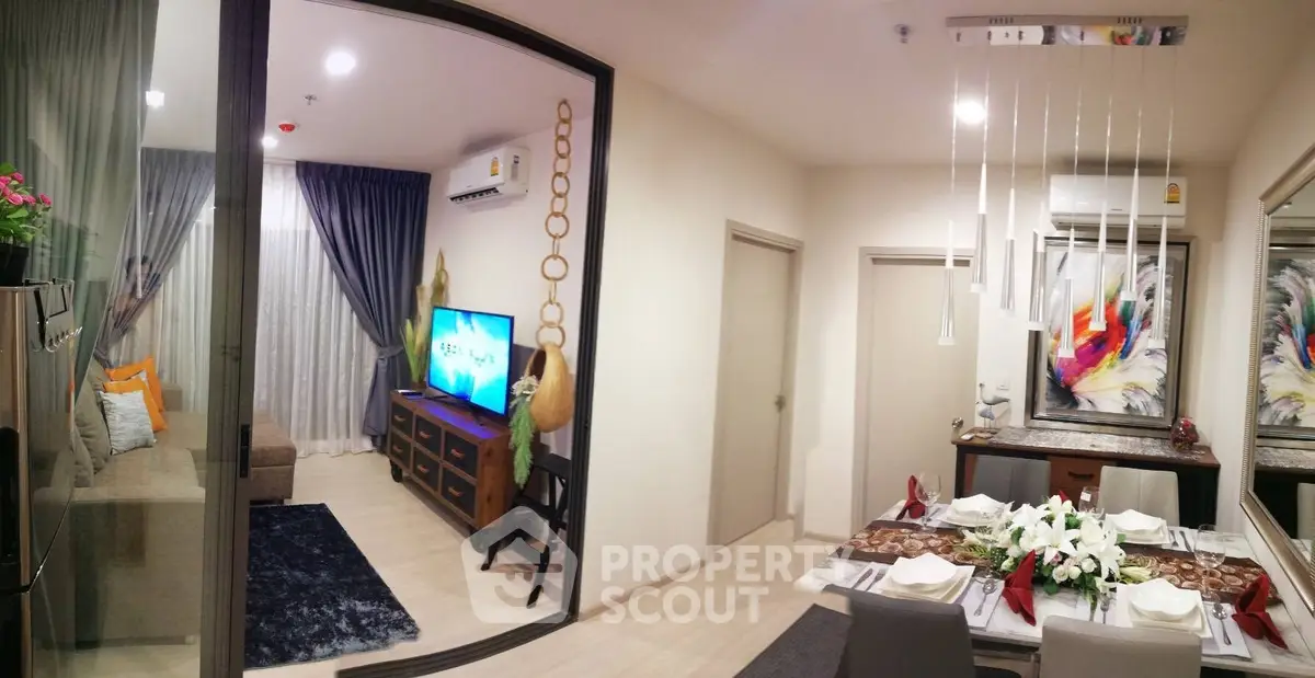 Modern open-plan living and dining area with stylish decor and natural light.