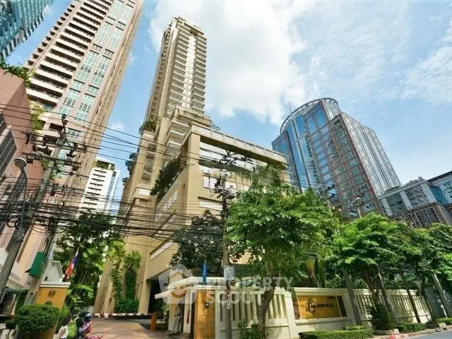 Stunning urban high-rise building with lush greenery and modern architecture in a vibrant cityscape.