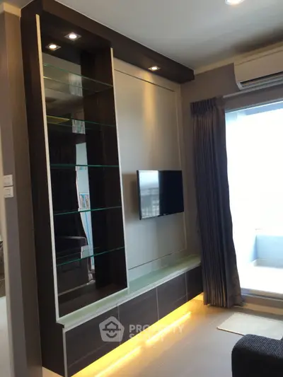 Modern living room with sleek TV unit and ambient lighting