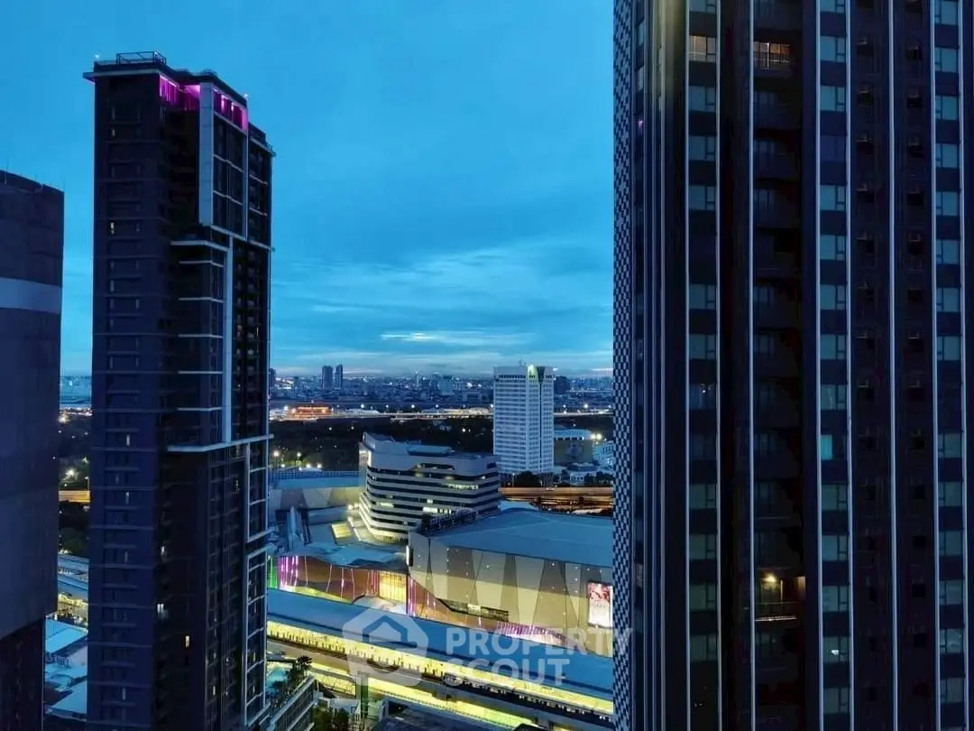 Stunning cityscape view from high-rise building at dusk, showcasing modern architecture and vibrant urban life.