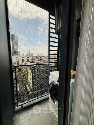 Urban balcony with washing machine and city skyline view