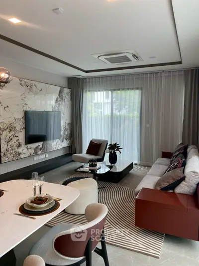 Luxurious modern living room with stylish decor and large window view