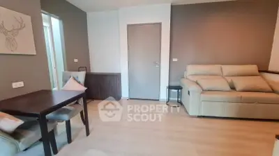 Modern living room with beige sofa and dining table, stylish decor