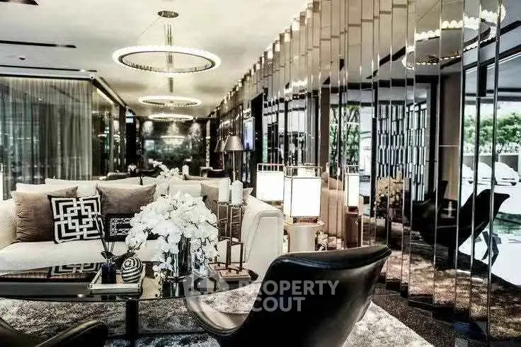 Luxurious modern living room with elegant decor and stylish lighting fixtures.