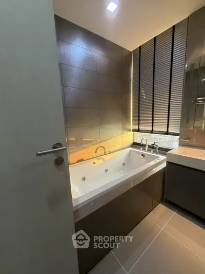 Luxurious bathroom with modern bathtub and sleek design, perfect for relaxation and comfort.