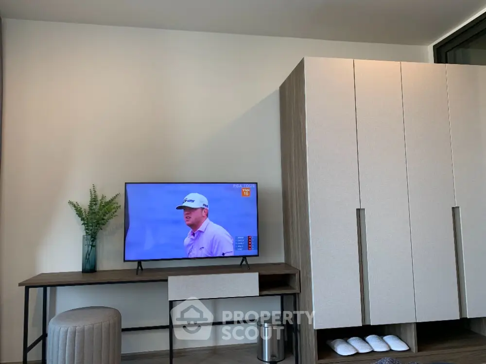 Modern living room with sleek TV stand and wardrobe, perfect for contemporary lifestyle.