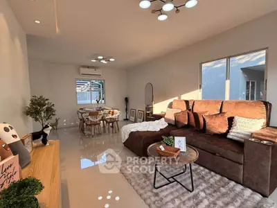 Spacious living room with modern decor and cozy seating area
