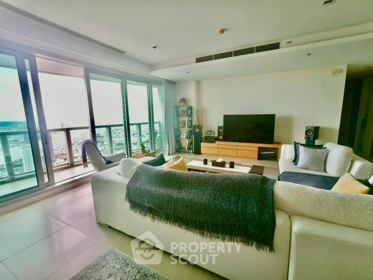 Spacious living room with panoramic city view and modern furnishings