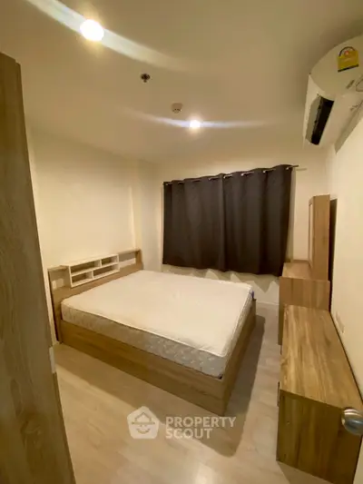 Cozy bedroom with wooden furniture and soft lighting