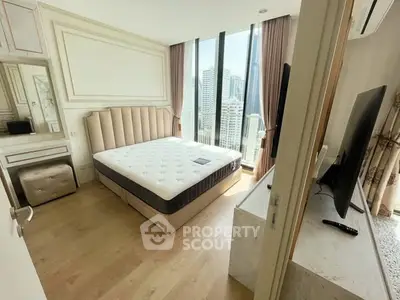 Luxurious bedroom with city view, featuring elegant decor and large windows for natural light.