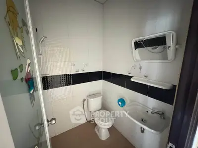 Modern bathroom with sleek fixtures and stylish tile design.