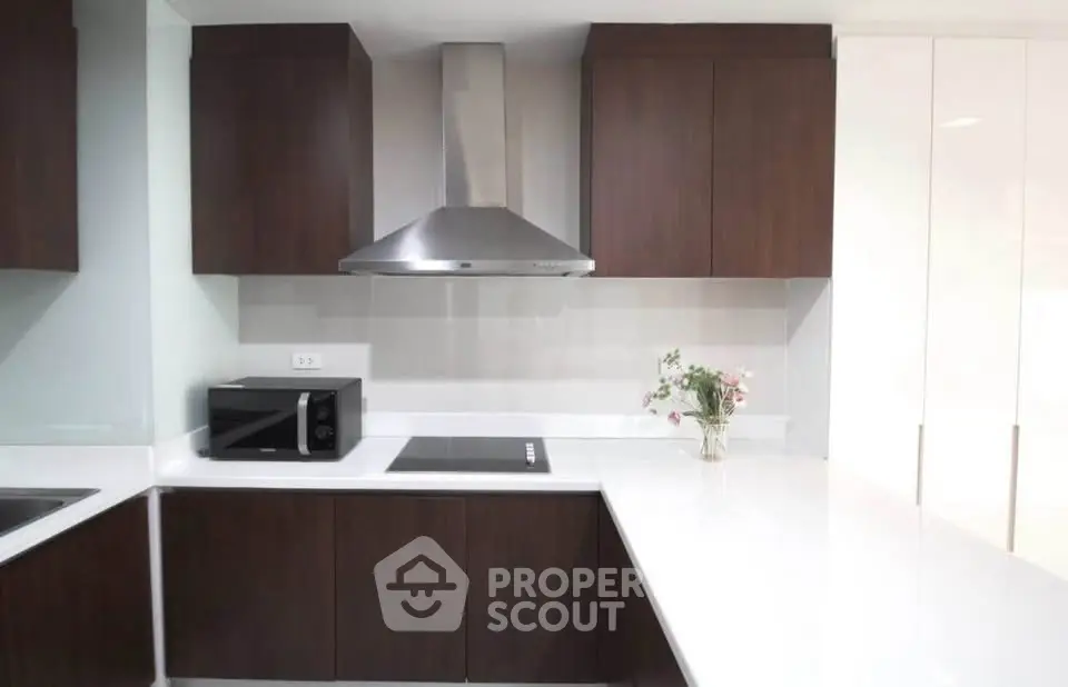 Modern kitchen with sleek cabinetry and stainless steel appliances