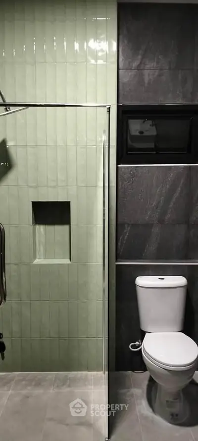 Modern bathroom with sleek design and glass shower enclosure