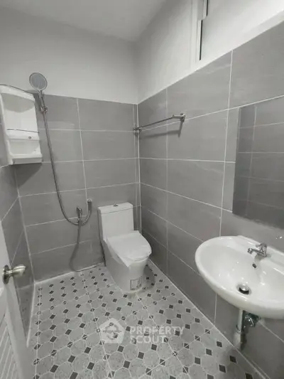 Modern bathroom with sleek gray tiles and contemporary fixtures