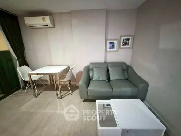 Cozy living room with modern furniture and air conditioning in a stylish apartment.