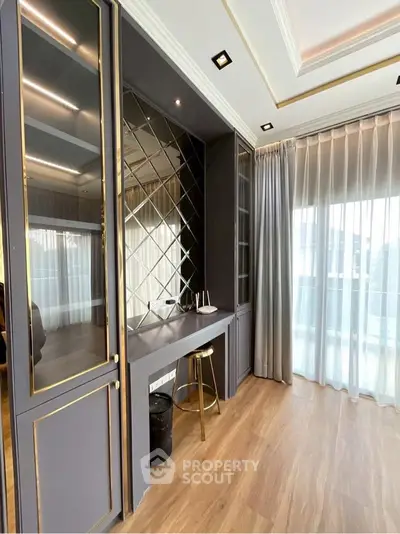 Elegant study area with floor-to-ceiling windows and luxurious decor