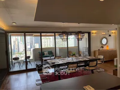 Spacious dining area with city view and large balcony, perfect for entertaining guests.