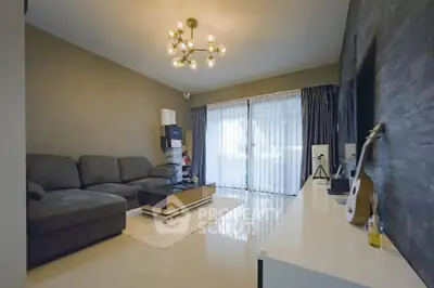 Modern living room with stylish decor and large windows for natural light