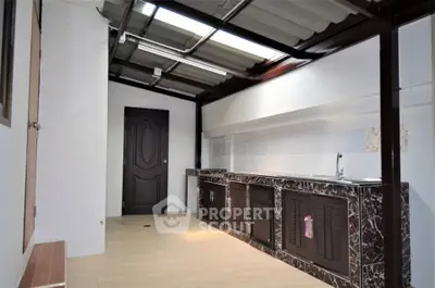Spacious kitchen with modern cabinetry and sleek countertops