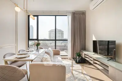 Elegant living room with modern decor, large windows, and city view, perfect for urban living.
