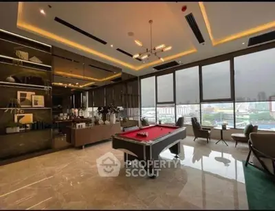 Luxurious living room with pool table and stunning city view
