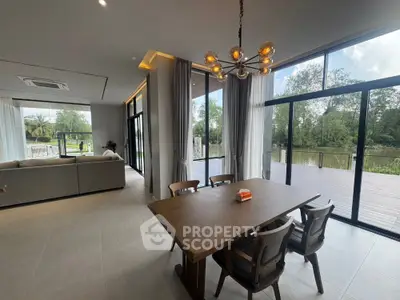 Luxurious open-plan dining and living area with stunning garden view