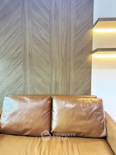 Luxurious leather sofa with elegant wood paneling and ambient lighting