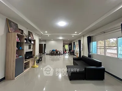 Spacious living room with modern furniture and ample natural light